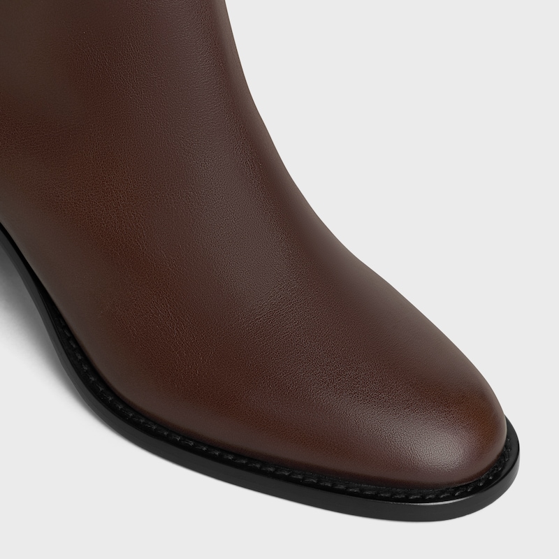 bottes hautes à brides triomphe en cuir de veau celine garance
