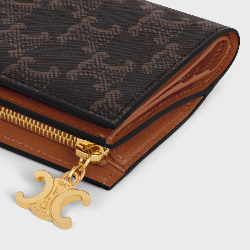 portefeuille compact triomphe charms en toile triomphe