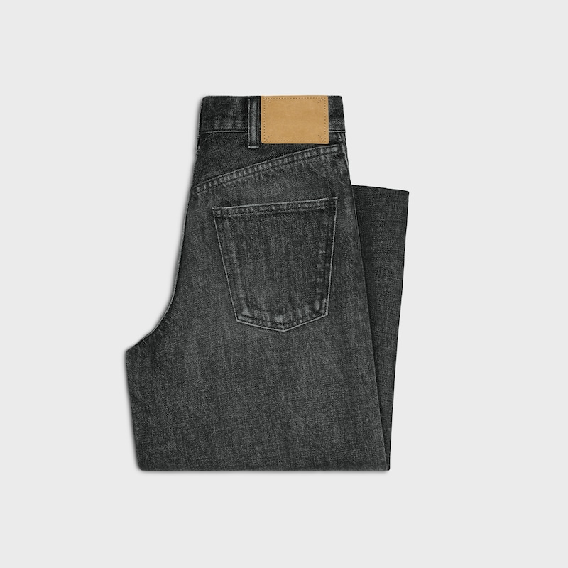 jean de surf évasé en denim noir délavé.